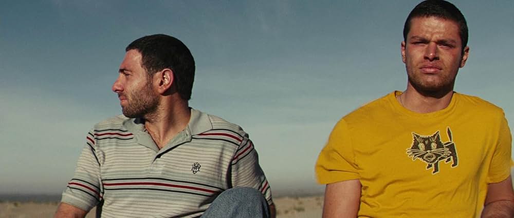 ヤギと男と男と壁との画像