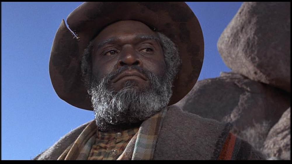 盗賊と馬と拳銃との画像