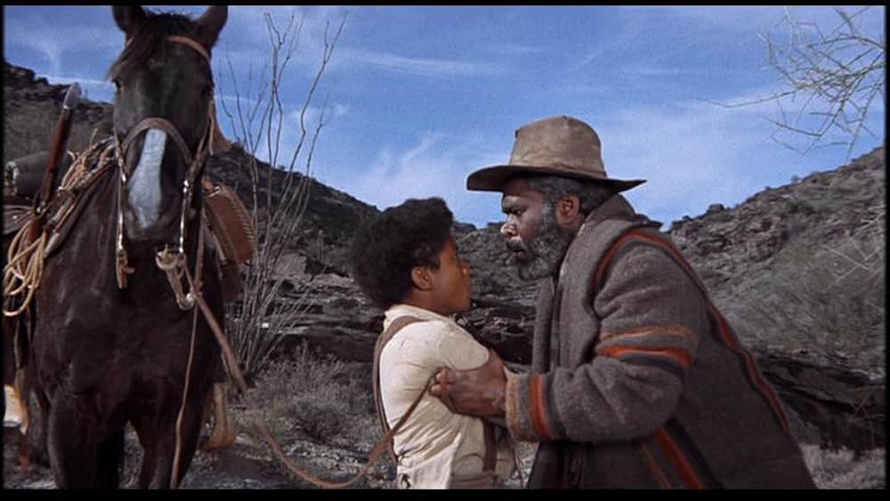 盗賊と馬と拳銃との画像