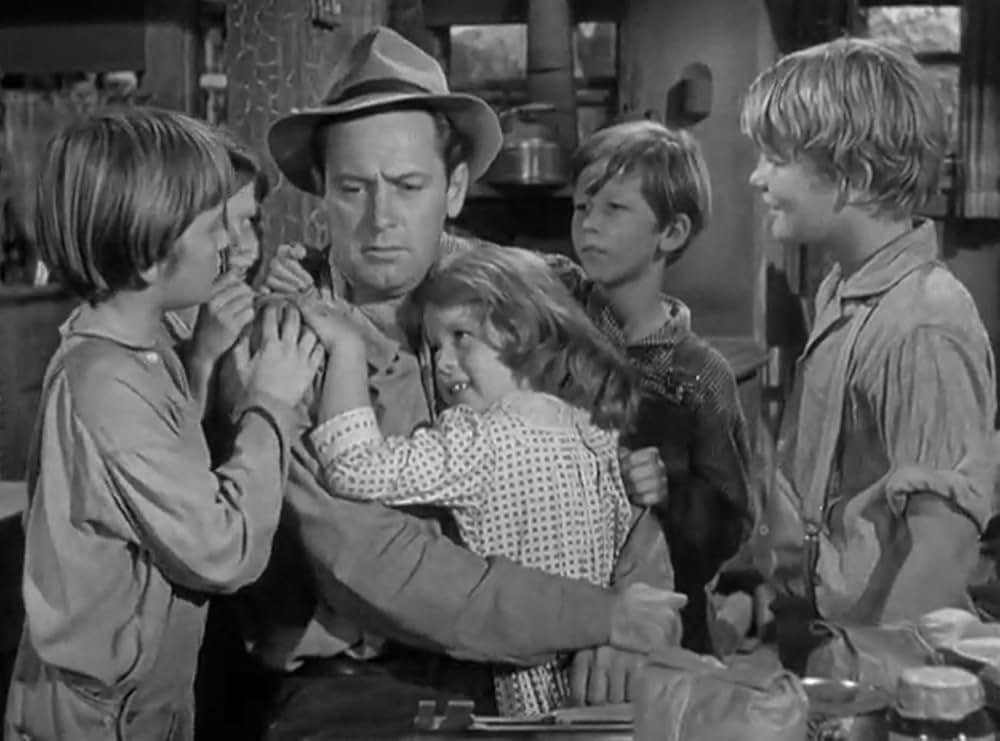 おじさんと孤児の画像