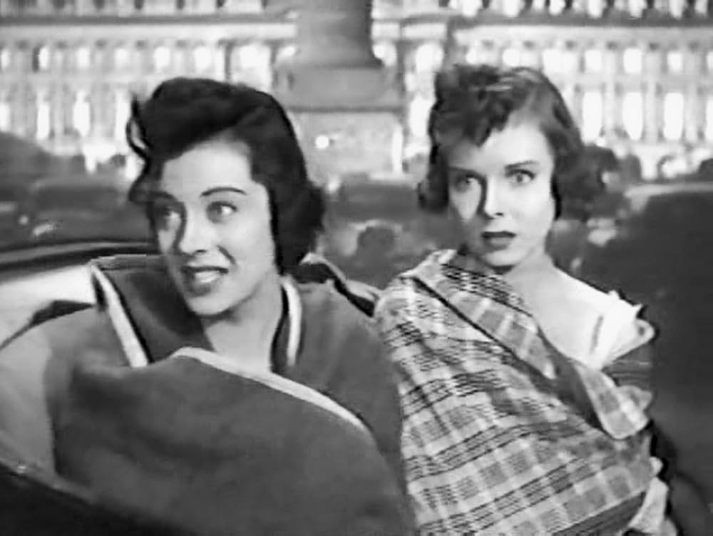 桃色の旅行鞄の画像