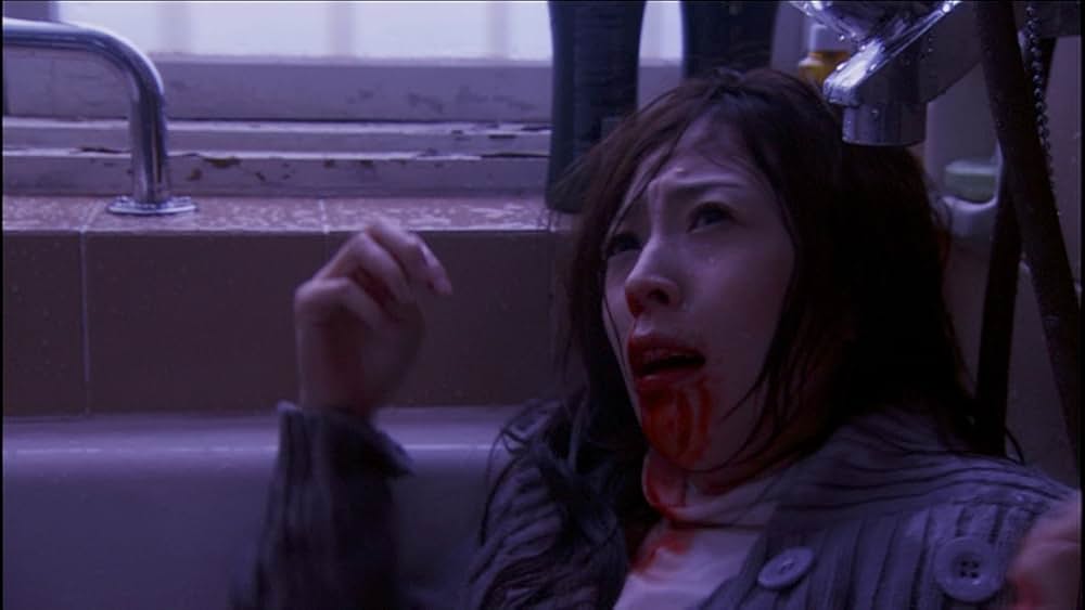 呪怨 白い老女の画像