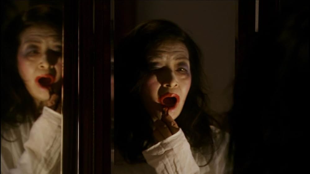 呪怨 白い老女の画像