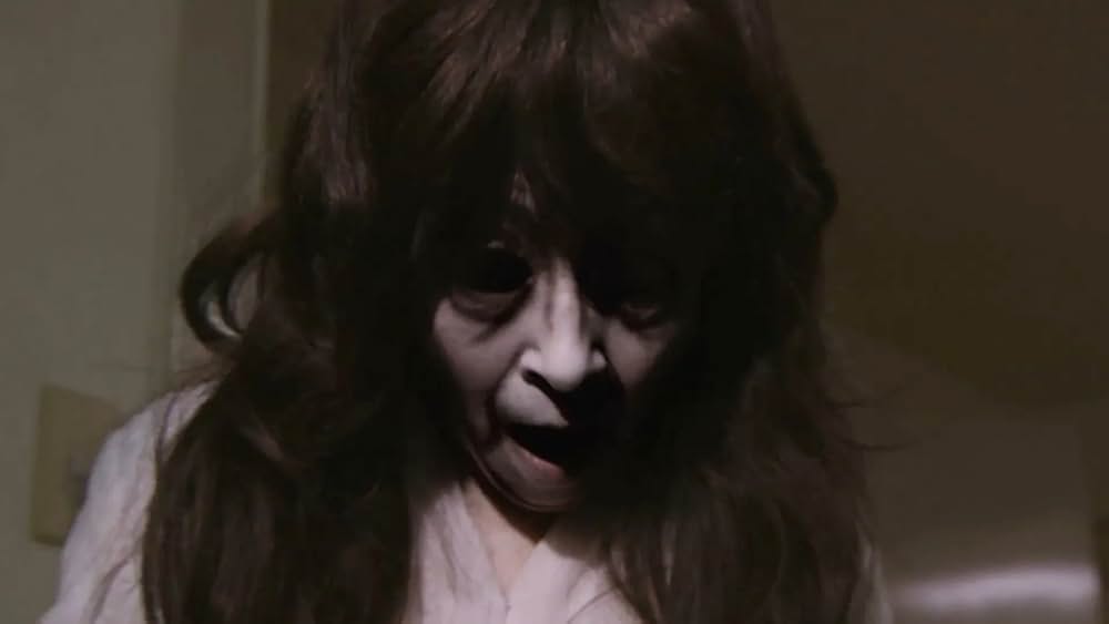 呪怨 白い老女の画像