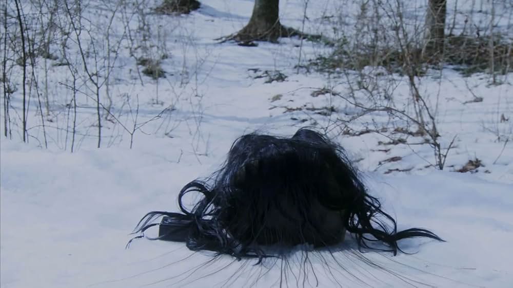 呪怨 白い老女の画像