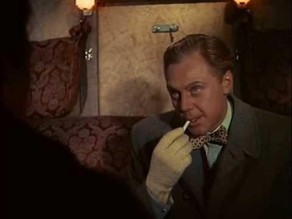 汽車を見送る男の画像