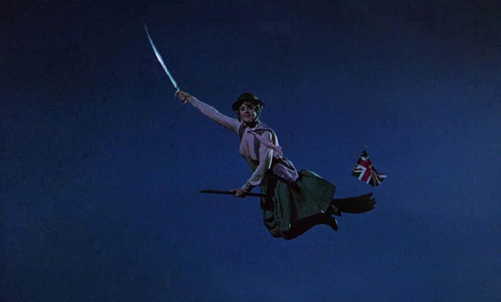 ベッドかざりとほうきの画像