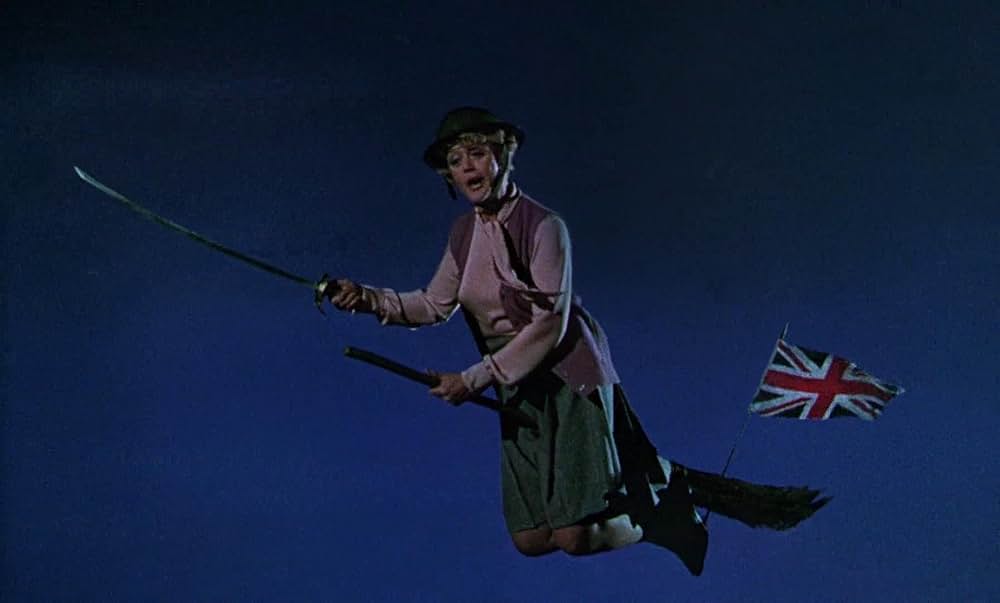 ベッドかざりとほうきの画像