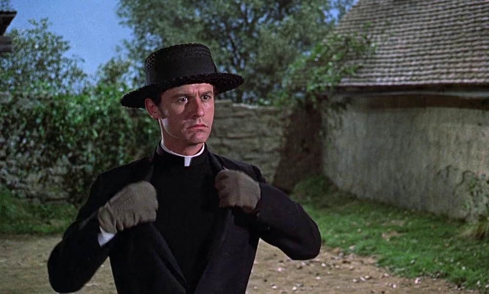 ベッドかざりとほうきの画像