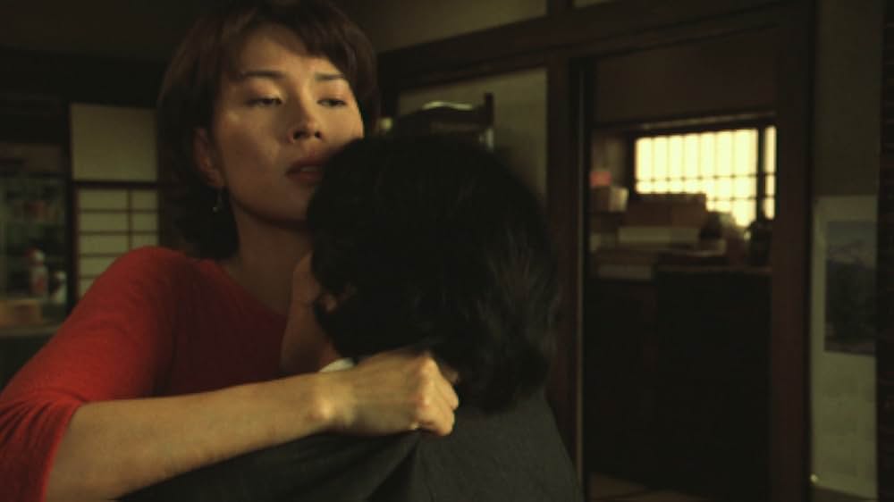 赤い橋の下のぬるい水の画像