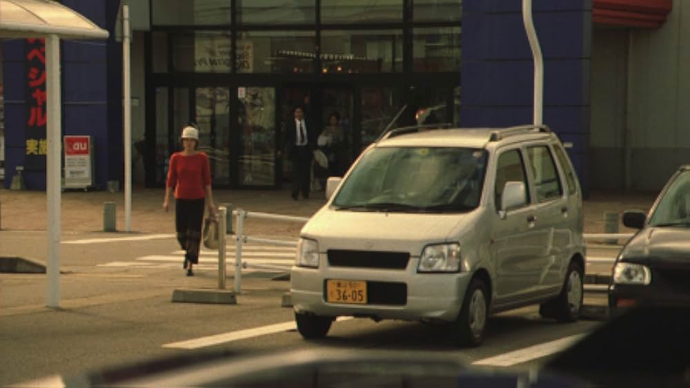 赤い橋の下のぬるい水の画像