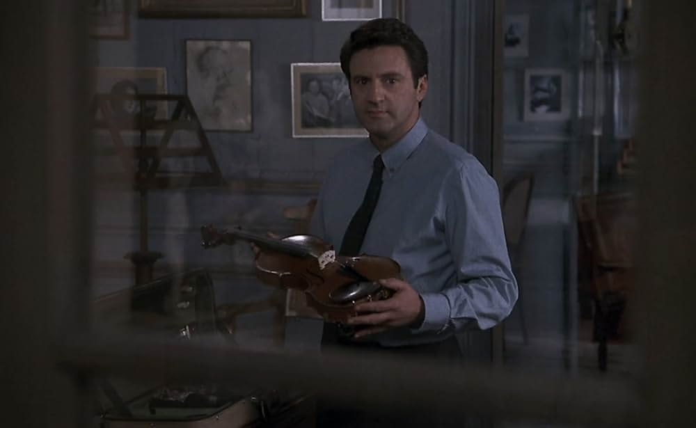 愛を弾く女の画像