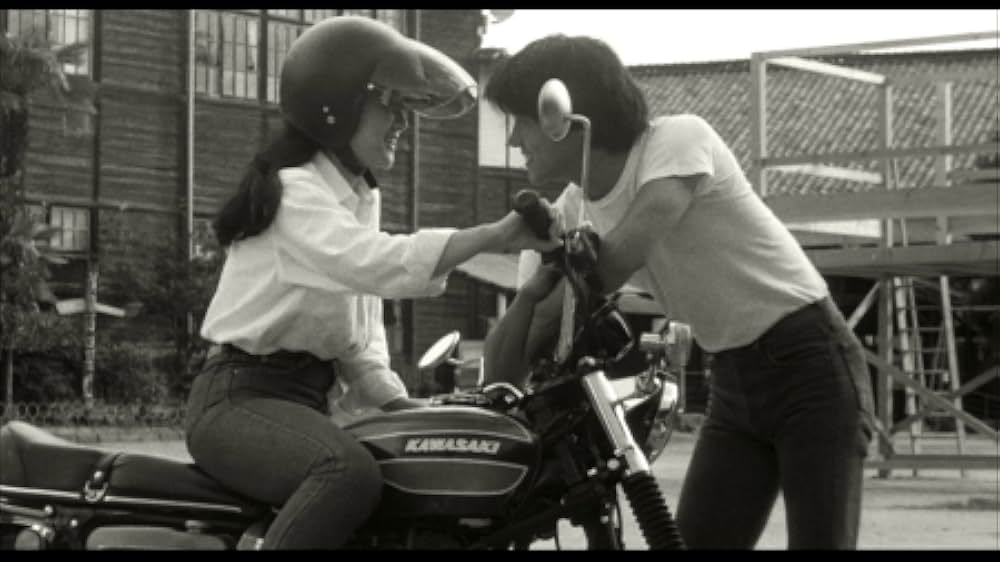 彼のオートバイ、彼女の島の画像