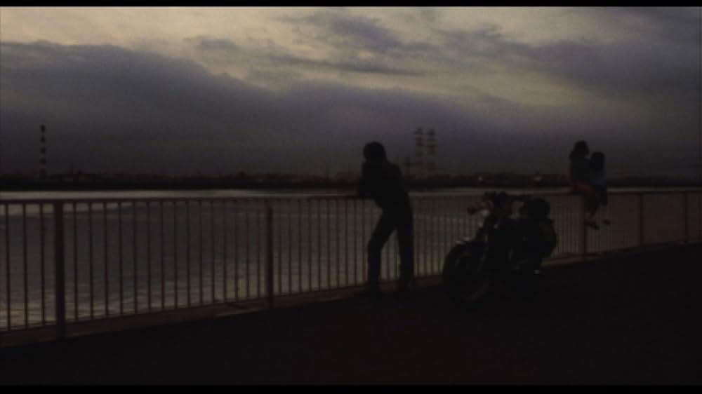 彼のオートバイ、彼女の島の画像