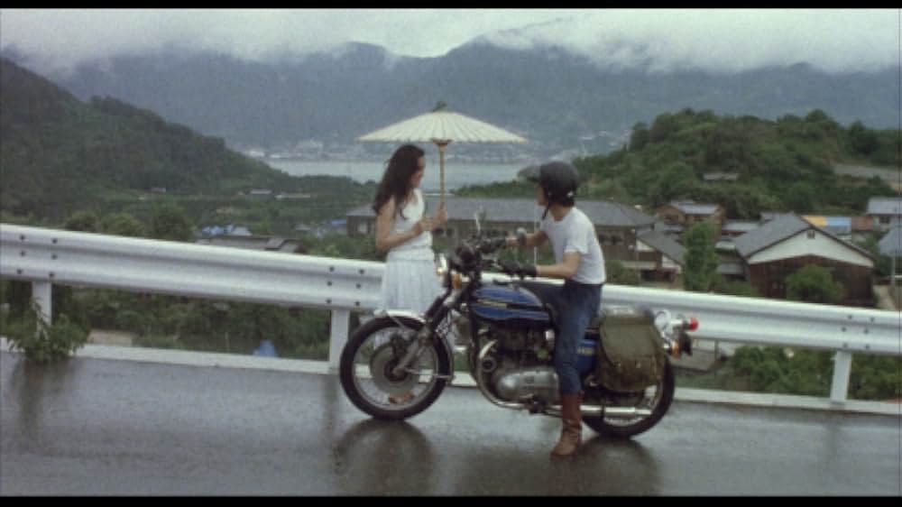 彼のオートバイ、彼女の島の画像