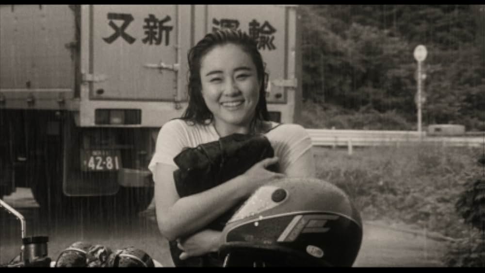 彼のオートバイ、彼女の島の画像