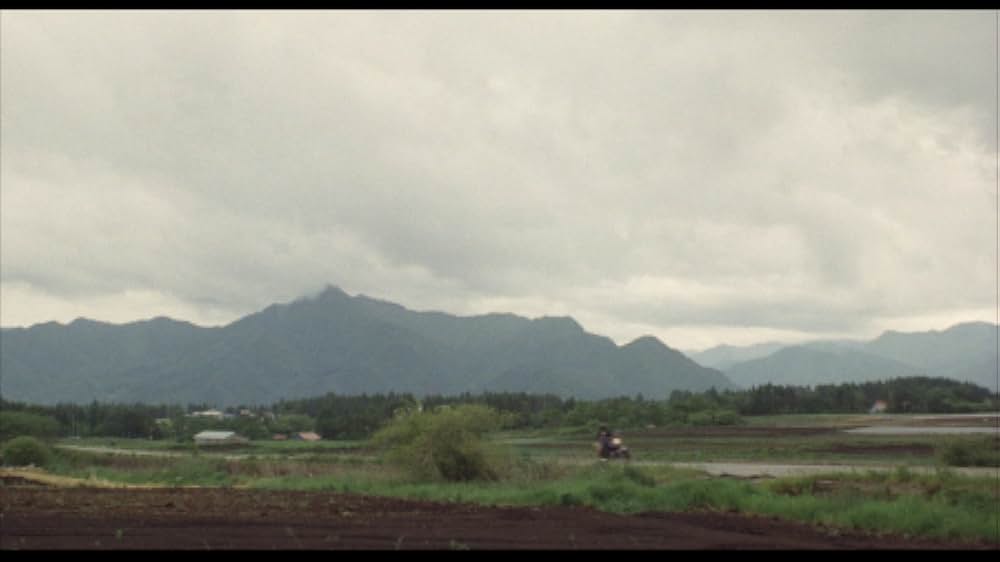 彼のオートバイ、彼女の島の画像
