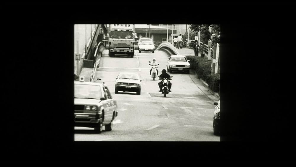 彼のオートバイ、彼女の島の画像