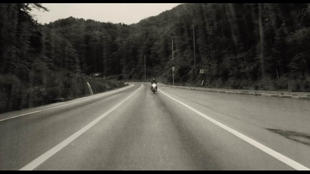 彼のオートバイ、彼女の島の画像