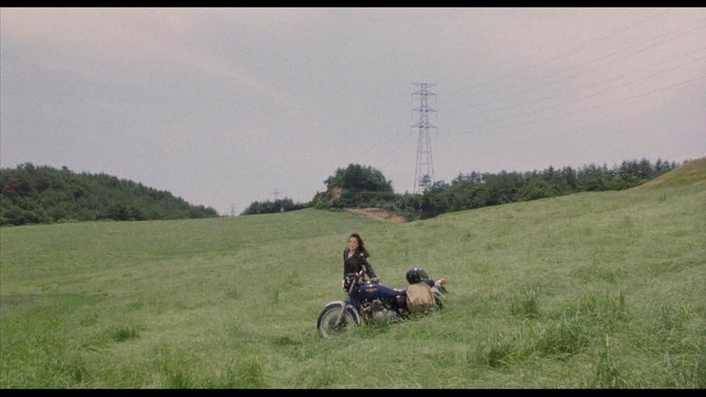 彼のオートバイ、彼女の島の画像