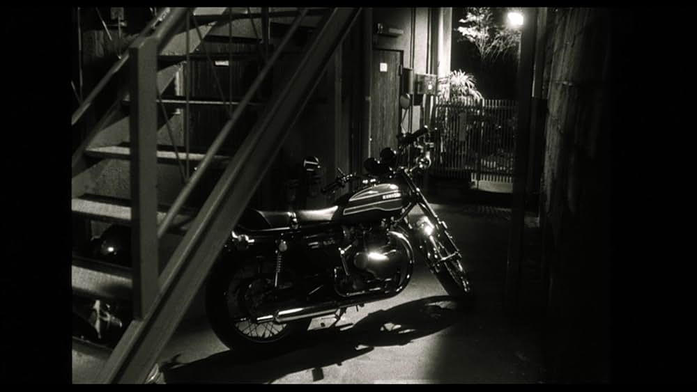 彼のオートバイ、彼女の島の画像