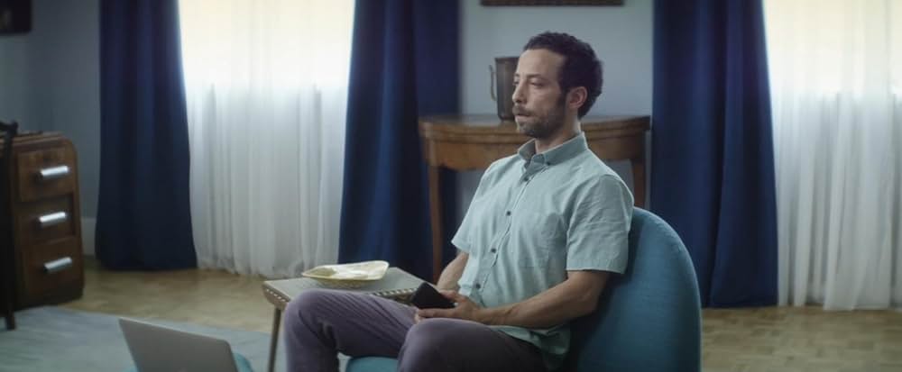 皮膚を売った男の画像