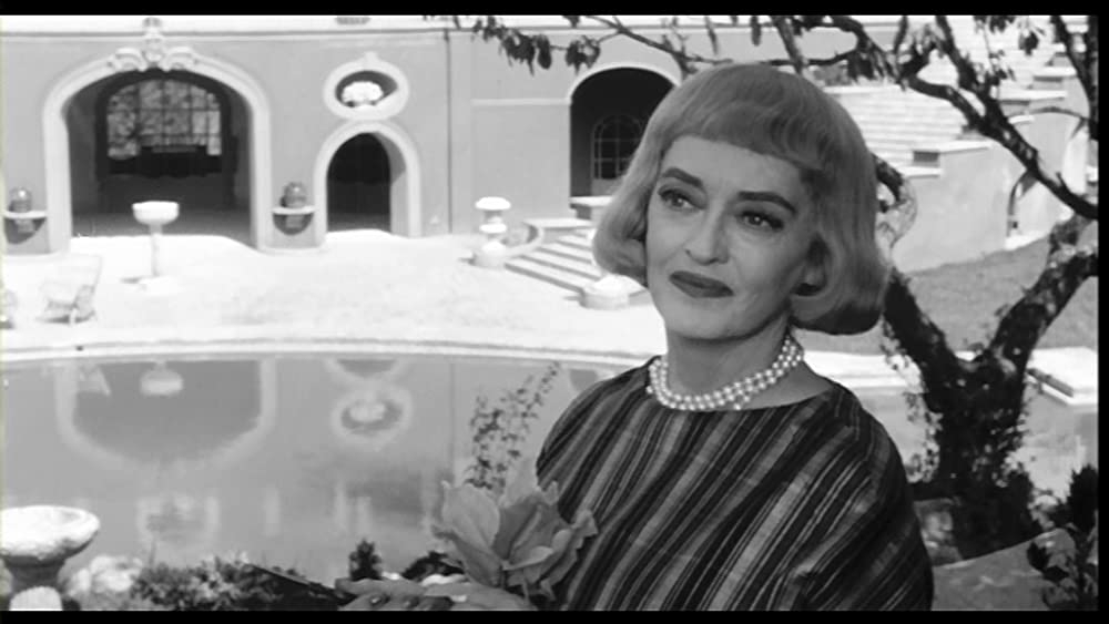 「禁じられた抱擁」ベティ・デイビスの画像