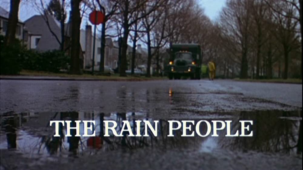 雨のなかの女の画像