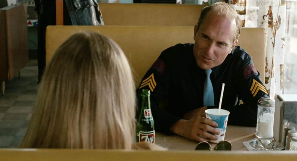 雨のなかの女の画像