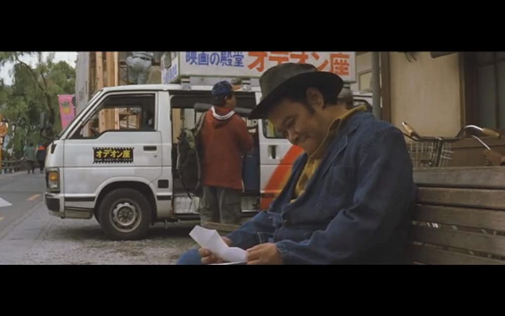 虹をつかむ男の画像