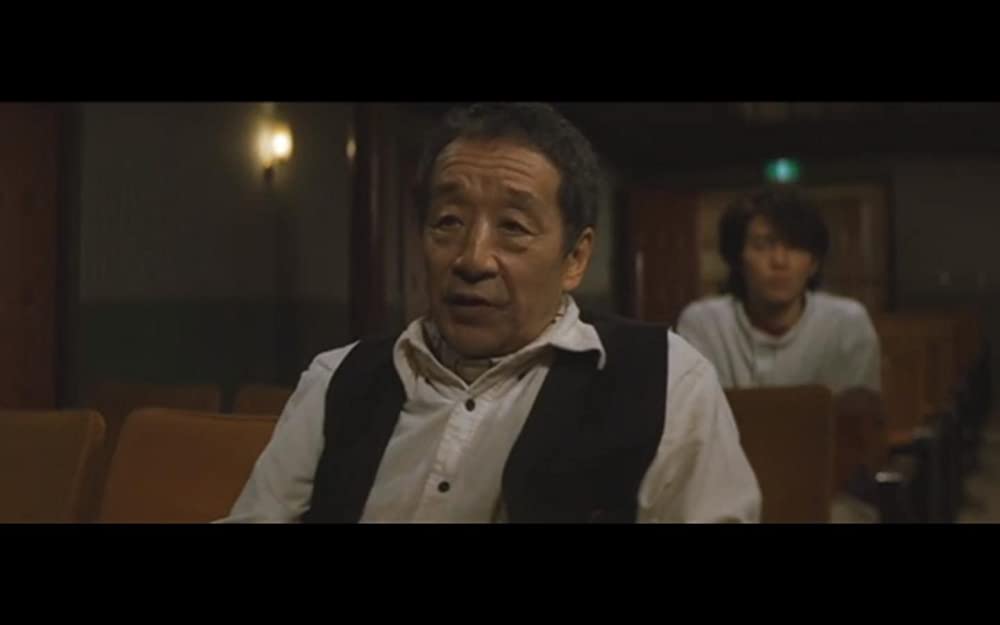 虹をつかむ男の画像