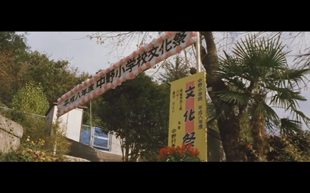 虹をつかむ男の画像