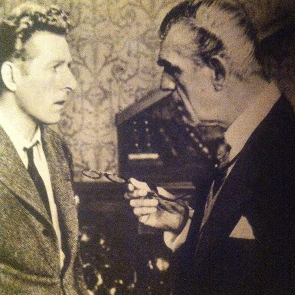 虹を掴む男の画像