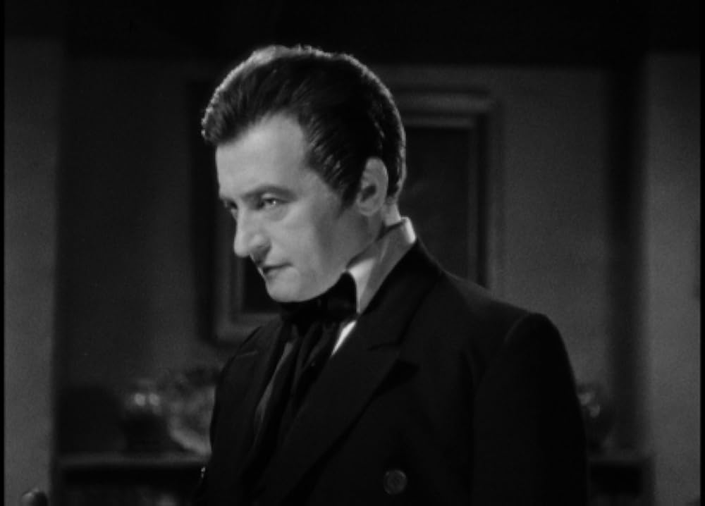 「幻しの合唱」クロード・レインズの画像