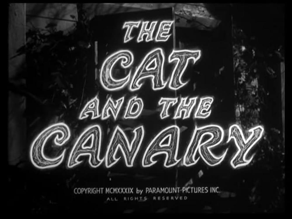 猫とカナリヤの画像