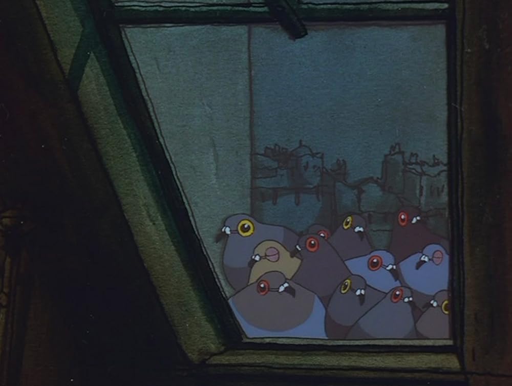 老婦人とハトの画像