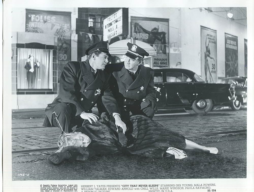 眠りなき街の画像