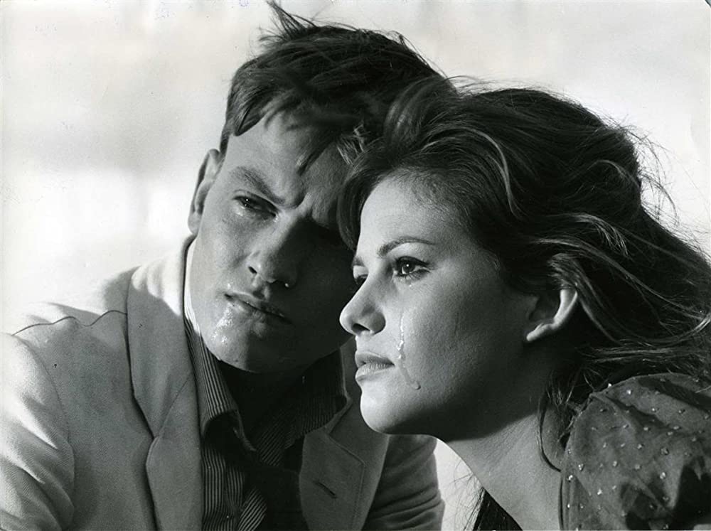 「鞄を持った女」クラウディア・カルディナーレ & ジャック・ペランの画像