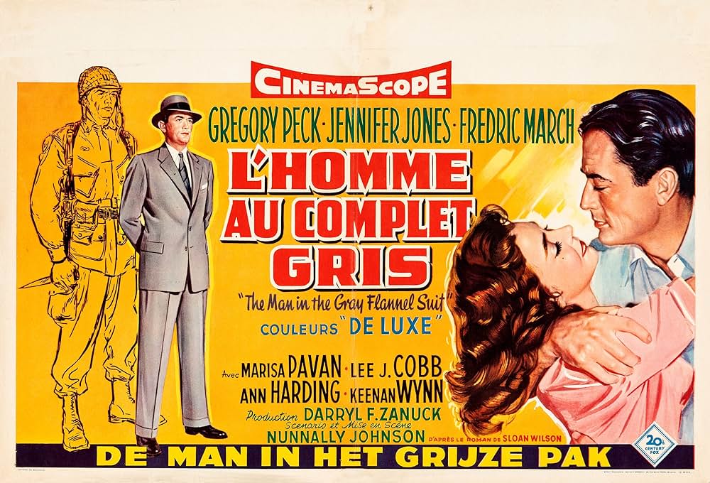 灰色の服を着た男の画像