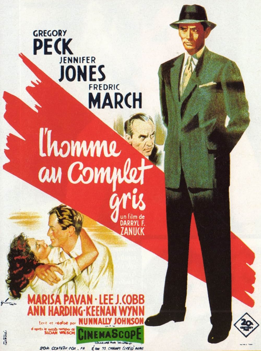 灰色の服を着た男の画像