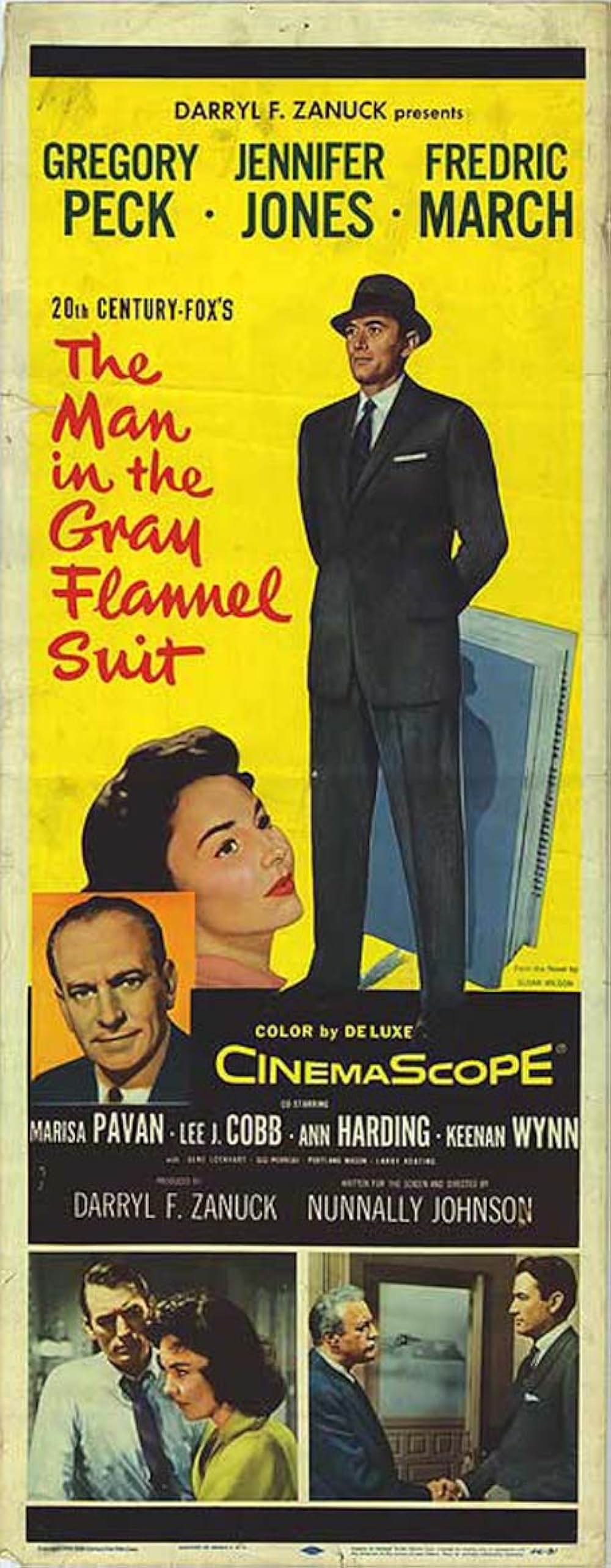 灰色の服を着た男の画像