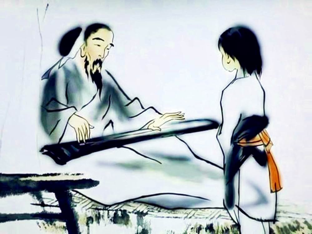 琴と少年の写真