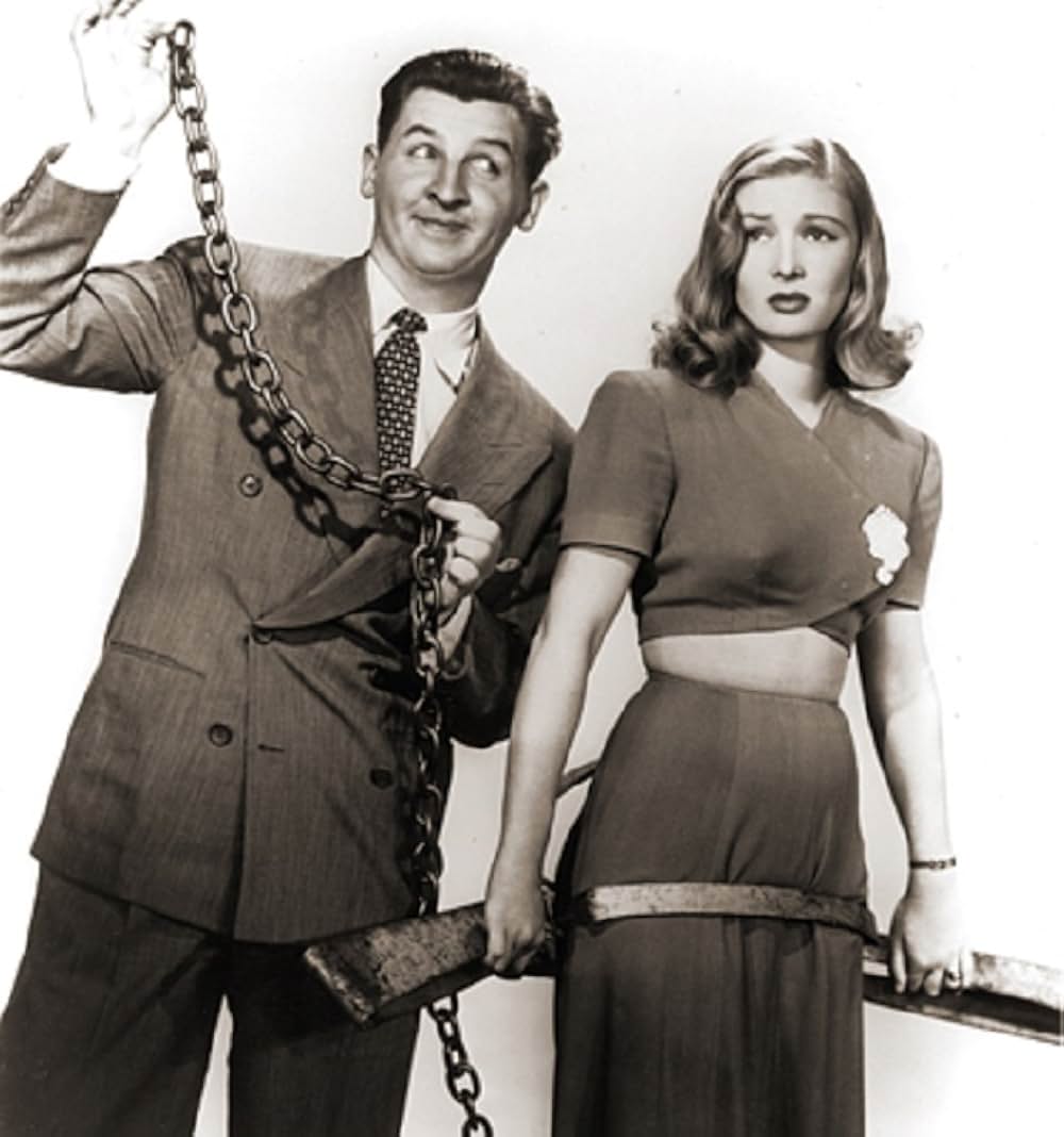 頓馬と金髪娘の画像