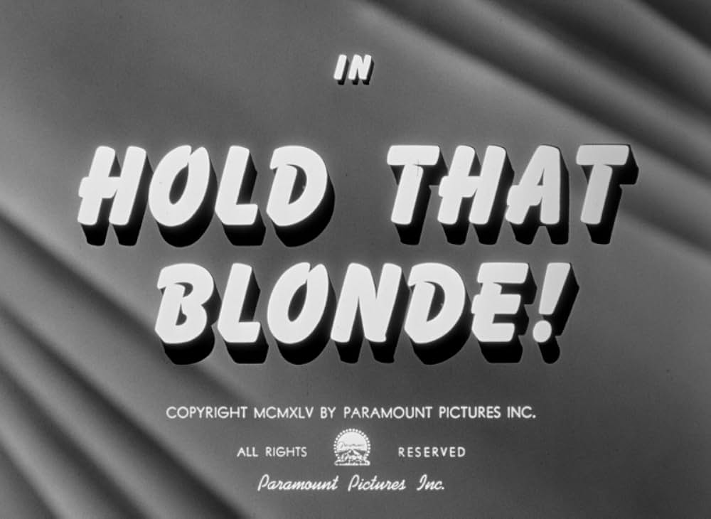 頓馬と金髪娘の画像