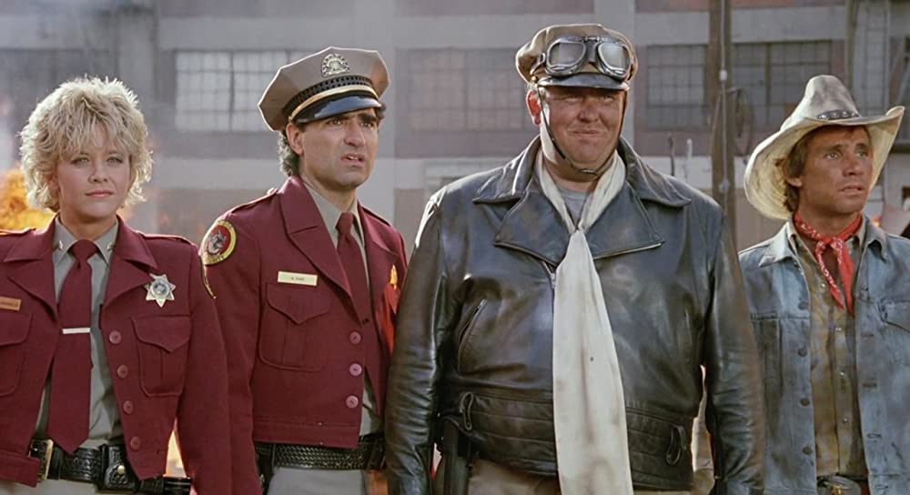 「私立ガードマン／全員無責任」メグ・ライアン & ジョン・キャンディ & ユージン・レビ & スティーブ・レイルズバックの画像