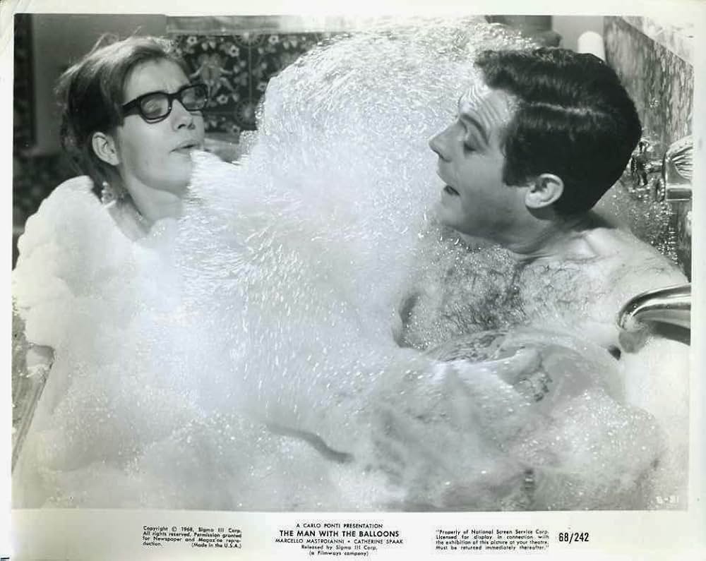 男と5つの風船の画像