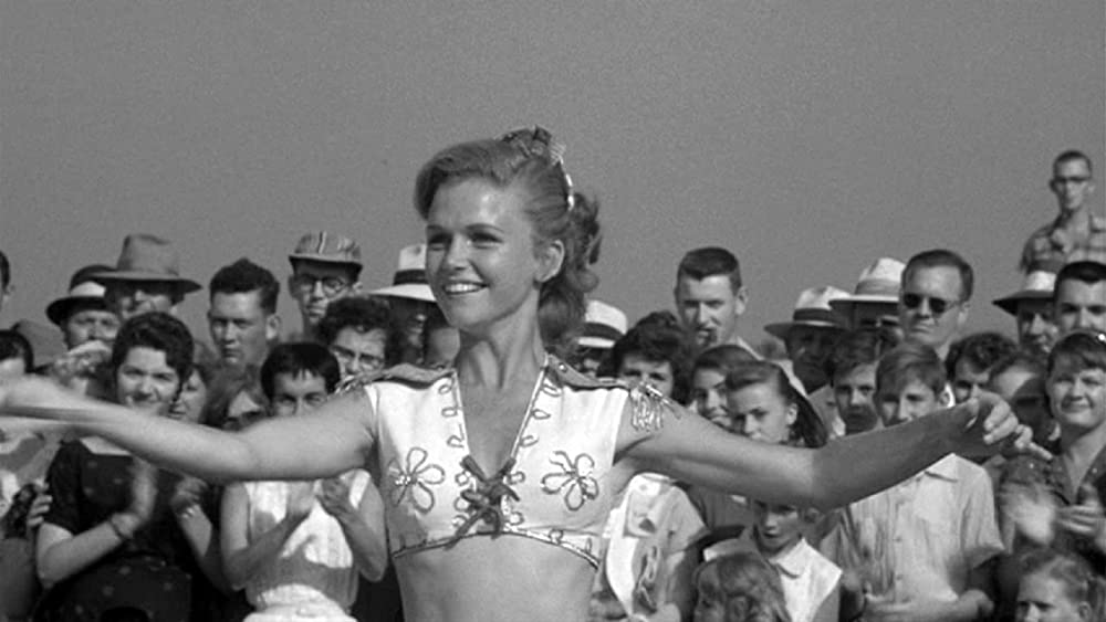 「群衆の中の一つの顔」リー・レミックの画像